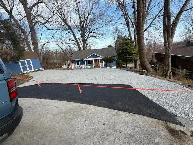 Asphalt apron tied into a gravel parking area, South State Paving, Southern Maryland