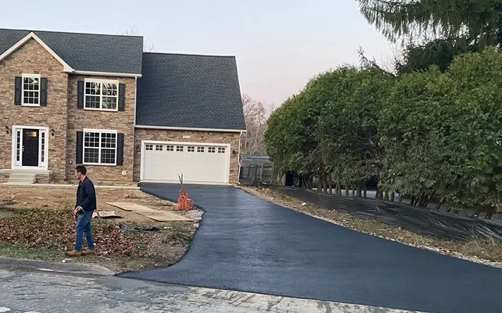 Curved new driveway to a brick colonial, South State Paving, Southern Maryland
