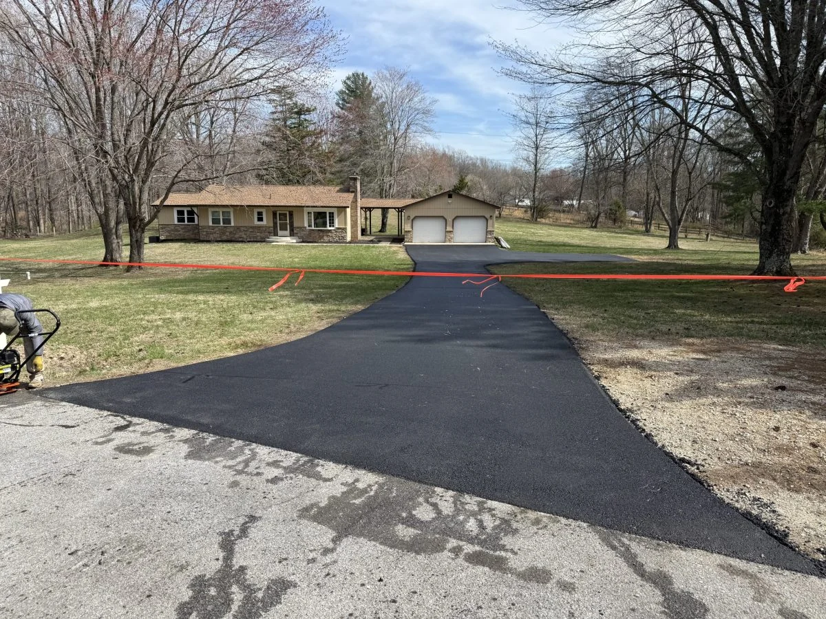 Flared driveway entrance at a rancher on a rural road, South State Paving, Southern Maryland
