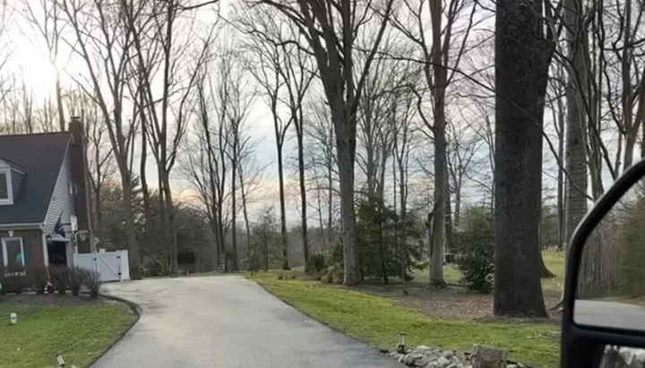 Long wooded residential lane, South State Paving, Southern Maryland