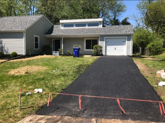 Straight single-car driveway replacement, string-lined edges, South State Paving, Southern Maryland